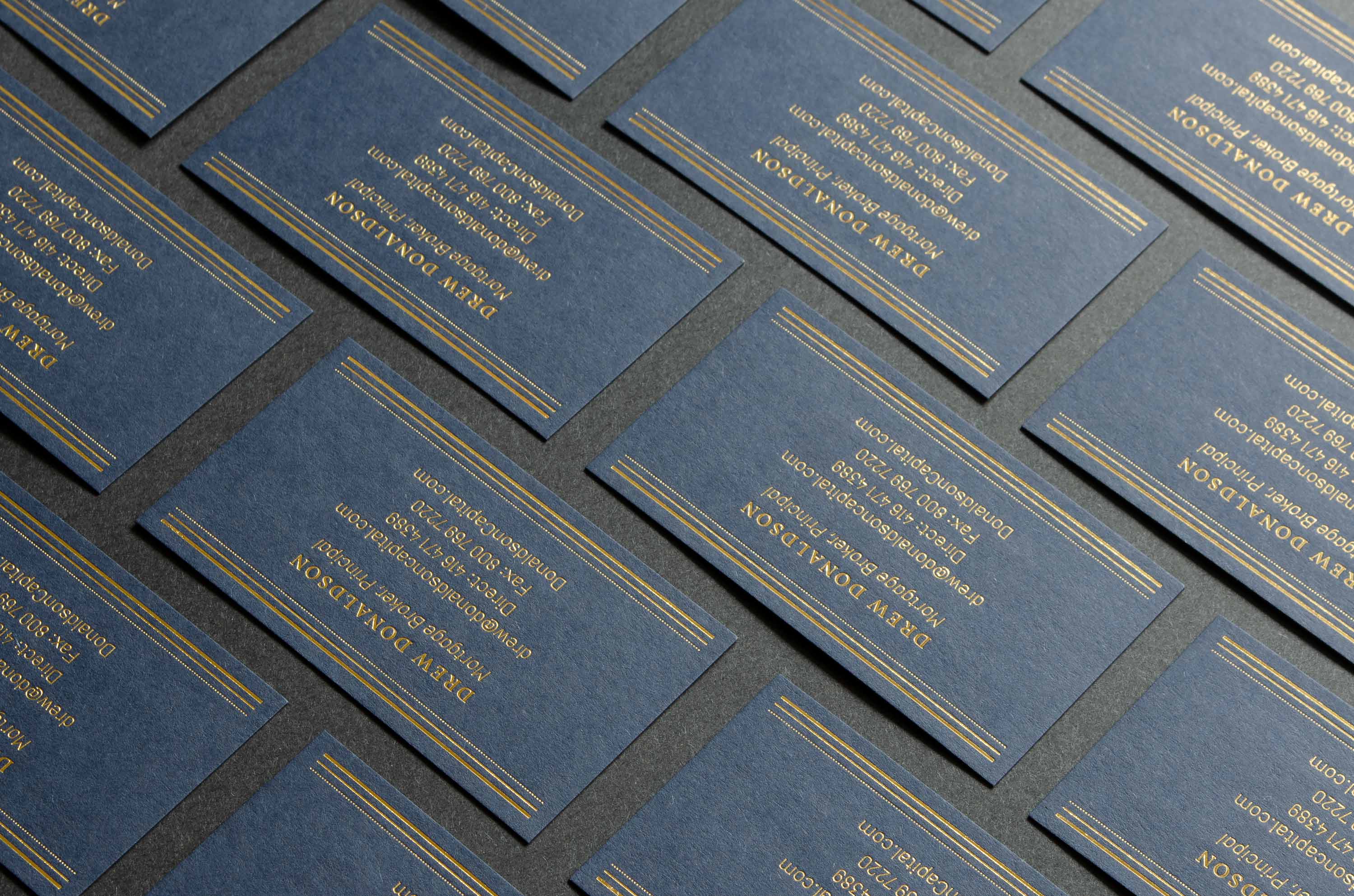 Multiple foil stamped custom branded business card design by Karbon Branding for Donaldson Capital, mortgage firm in Toronto, Canada.