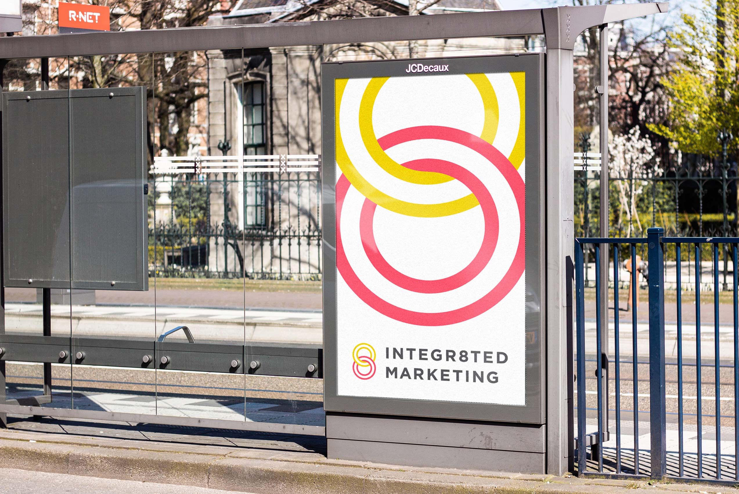 Marketing logo design on a bus stop billboard.